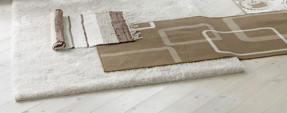 Create a cosy atmosphere with rugs design tips for using rugs rather than carpets