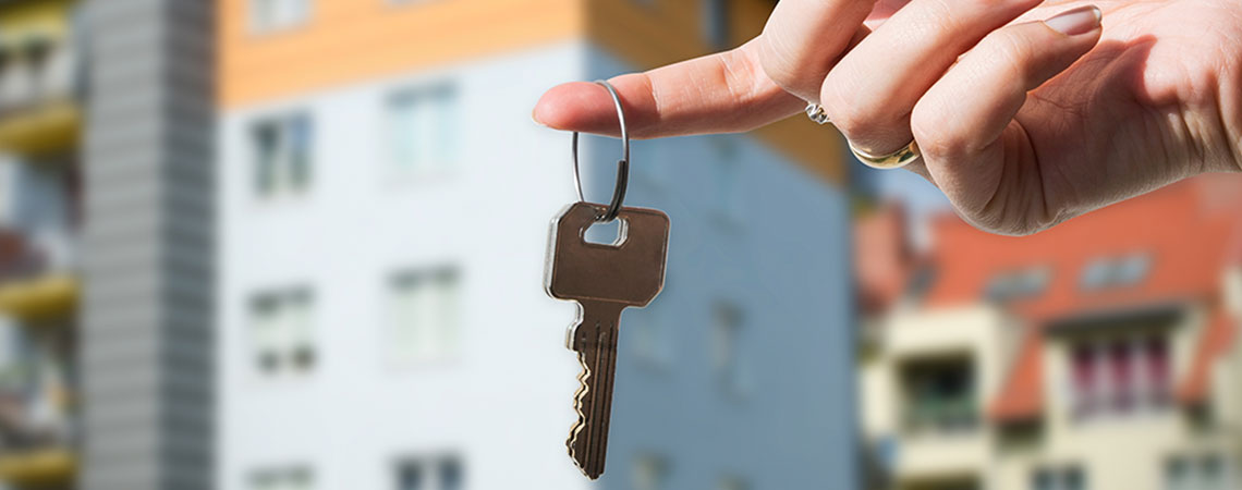 Woman renting out a room, holding the key