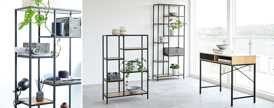 Bookcases with oak shelves and an oak desk in a light room