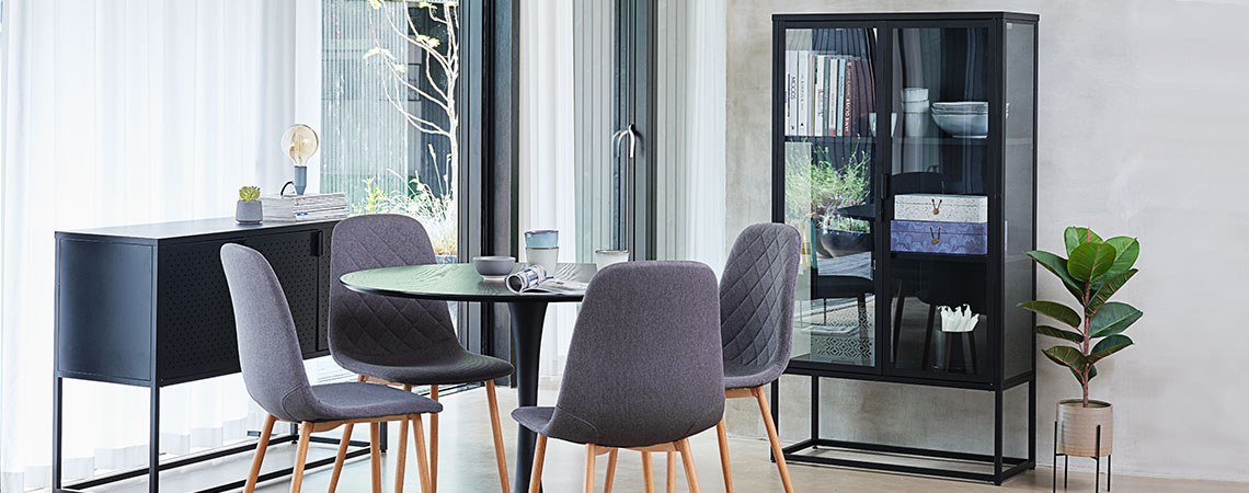 VIRUM cabinet with glass doors and sides, JONSTRUP dining chairs and VIRUM sideboard Glass cabinet in a dining room with a round dining table and four grey dining chairs