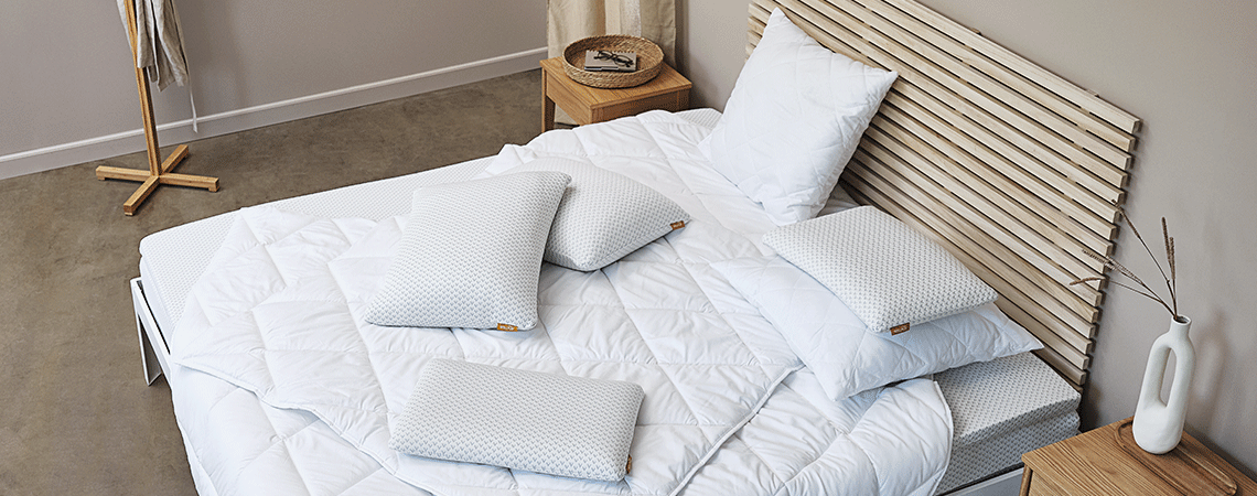 Learn how to choose the mattress size that will work best for your sleeping needs Bedroom with bed, mattress, top mattress, duvets and pillows