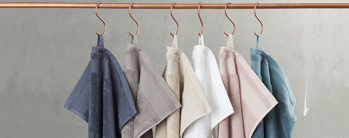 Bath towels hanging on a rail 