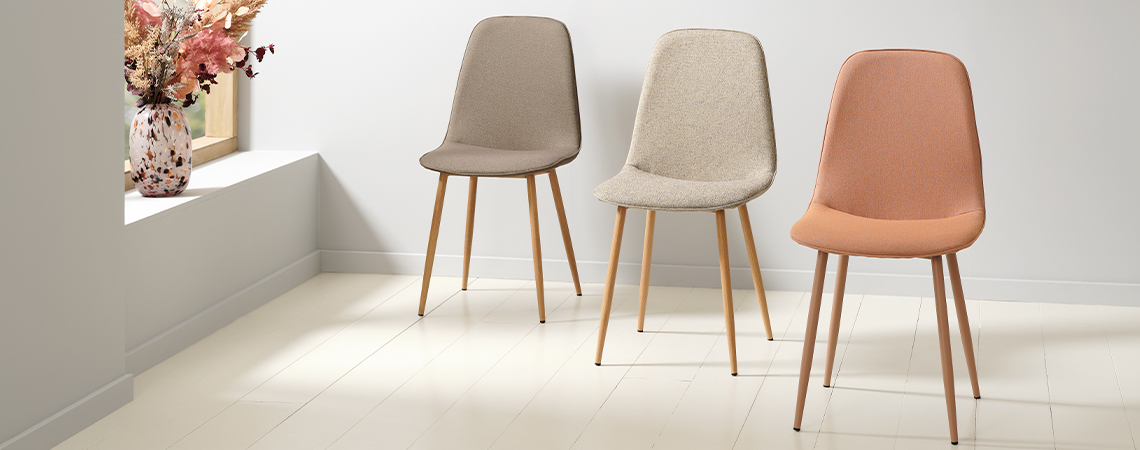 BISTRUP dining chair in olive, sand, and dusty peach colours Olive green dining chair, soft beige dining chair, and soft peach/coral dining chair