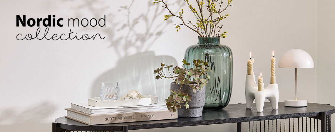 Décor ideas for your home: decorative tray, vase, candle holder, and battery lamp on a console table
