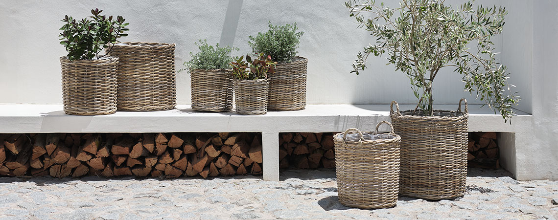 Rattan garden planters such as SEGLA are a timeless, classic choice Garden planters and garden pots made from rattan in bright garden