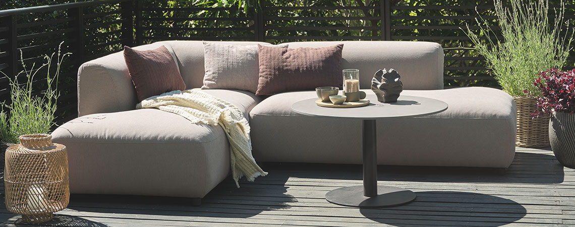 STORHOGNA lounge sofa can be left out all year All-weather lounge sofa on a wooden patio