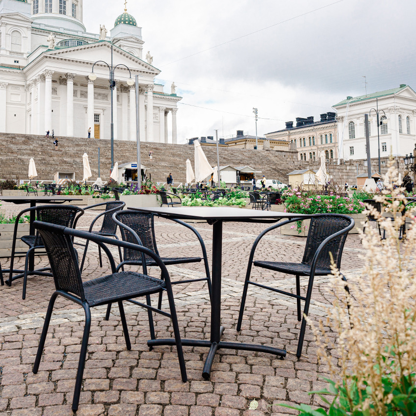 GRENAA stackable chair and garden table Senate Square equipped with garden furniture