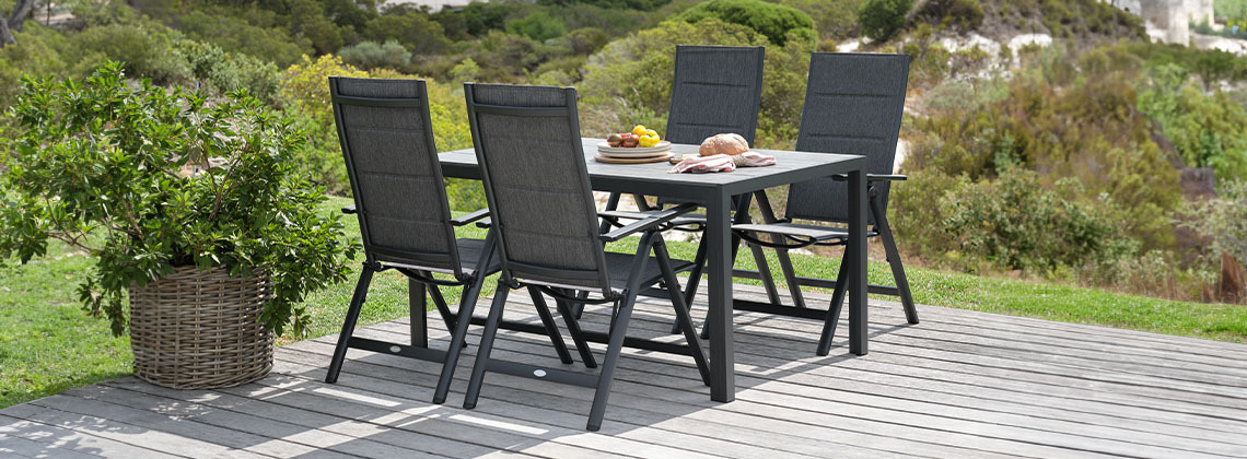 PINDSTRUP L205 table + 4 GUDHJEM chair grey Garden lounge set with garden table and chairs in garden next to plant
