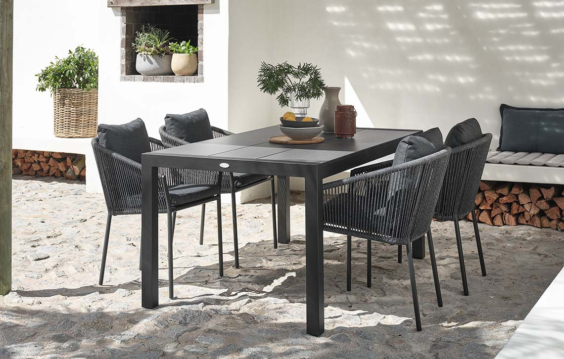 HAGEN garden table with composite wood table top and BRAVA garden chairs Garden table with composite wood table top and garden chairs with quick-dry cushions