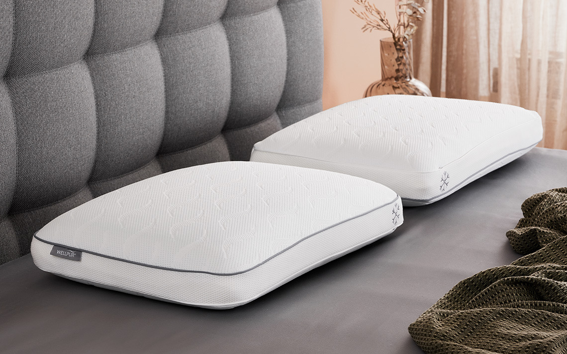 VARDO memory foam pillow with cooling gel layer and cooling cover Cooling pillows with memory foam filling and cooling cover on bed