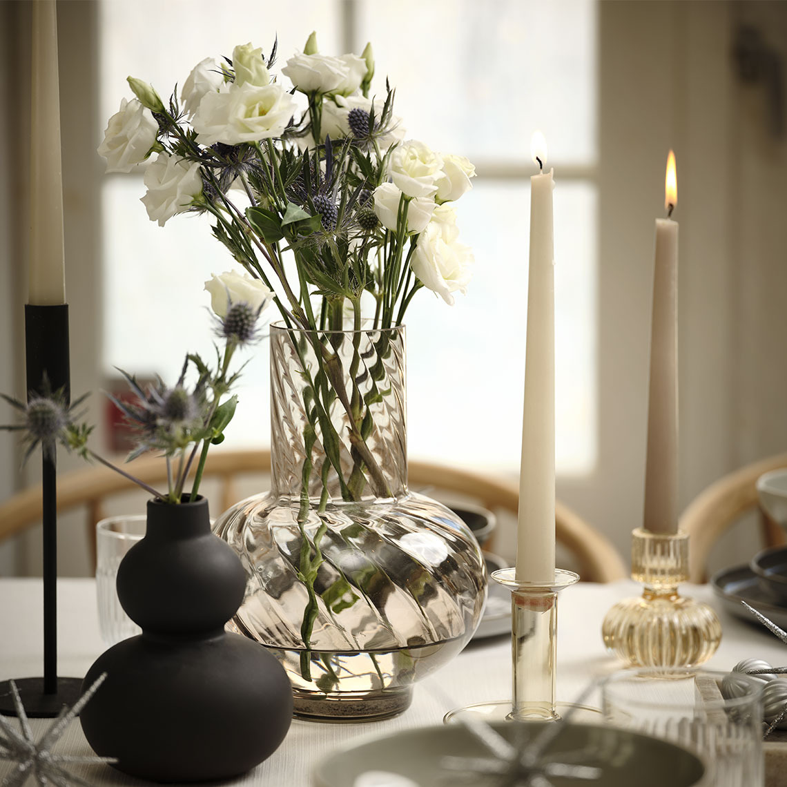 Black ROBERT vase and VILLY glass vase Flower vases on a table