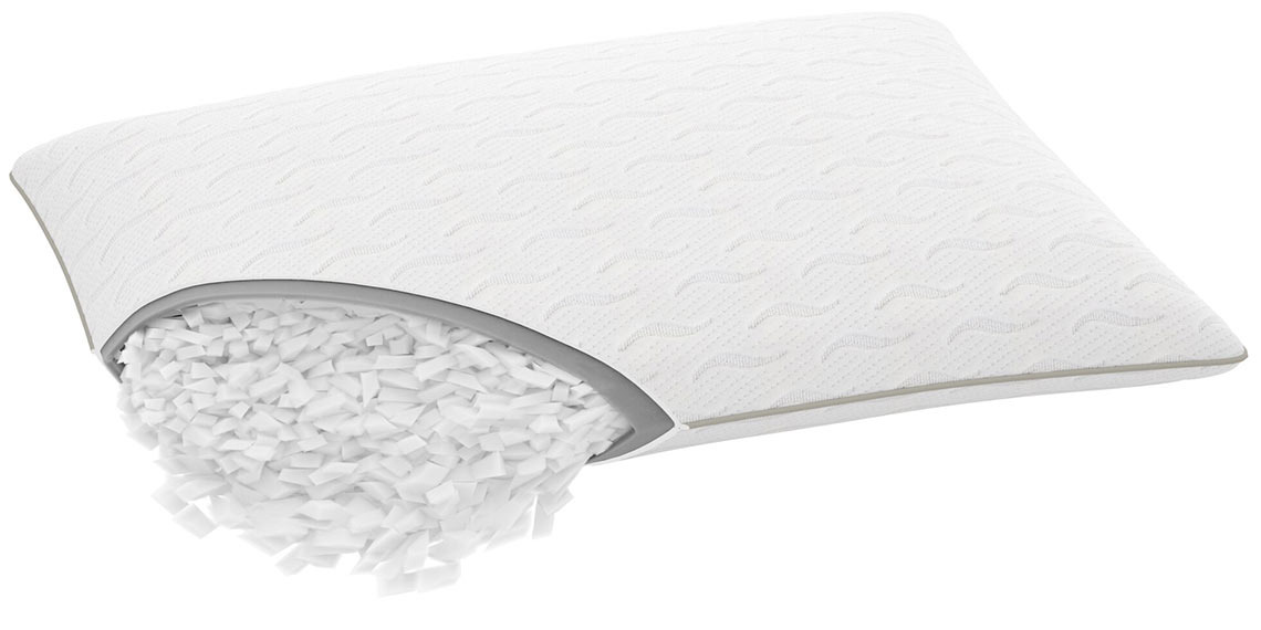 Pillow with a zipper that has been opened so the filling is coming out 