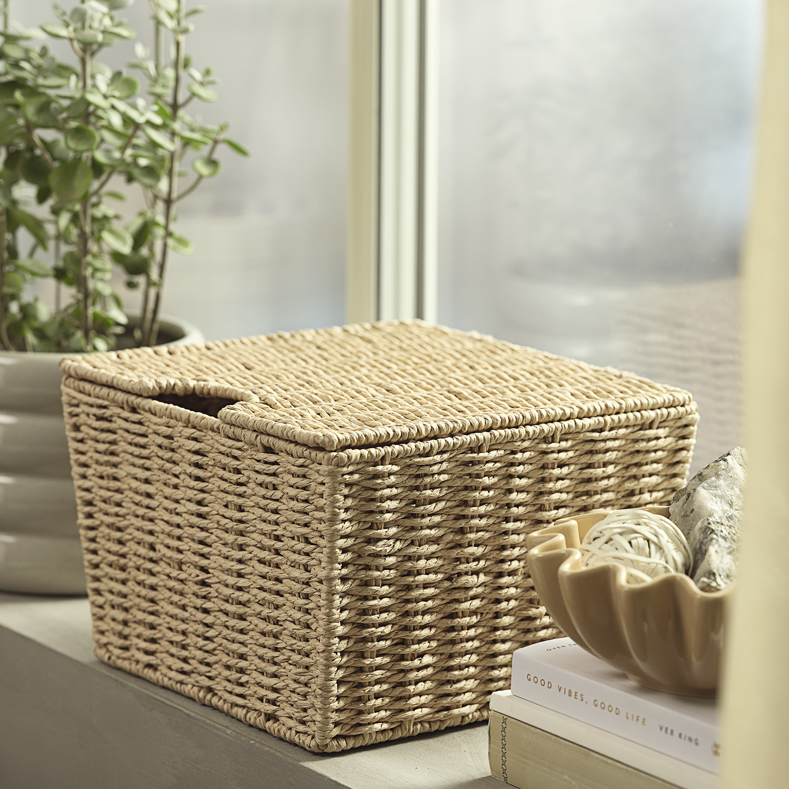Basket with lid on a windowsill