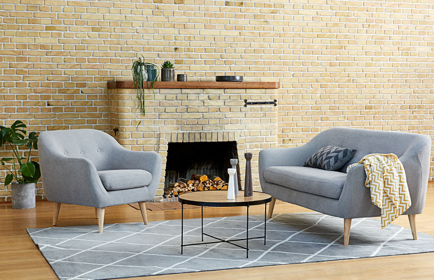 EGEDAL armchair and sofa and HADBJERG coffee table A living room with a grey sofa, a grey armchair and a coffee table