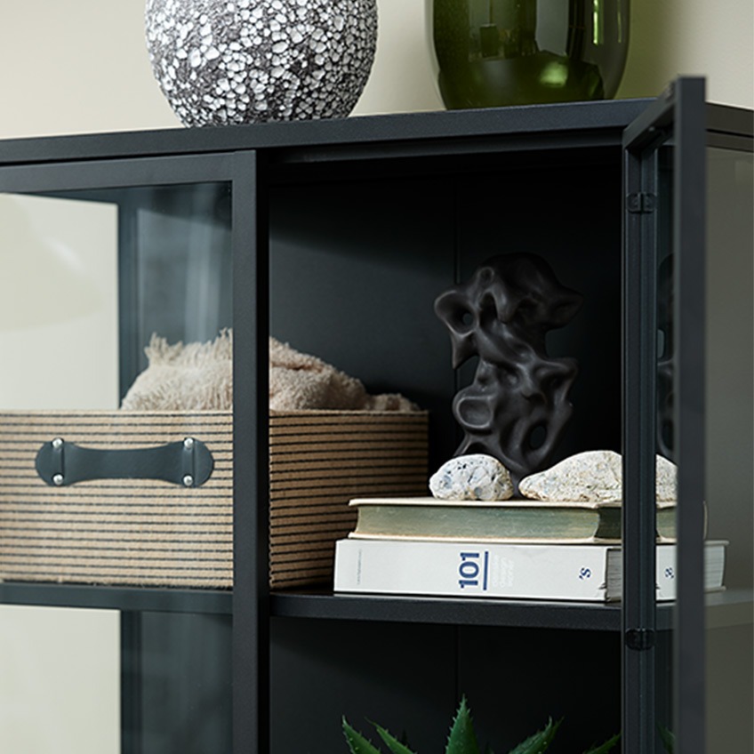 TORFINN basket next to STEN ornament inside VIRUM display cabinet Different decorative accessories in a display cabinet