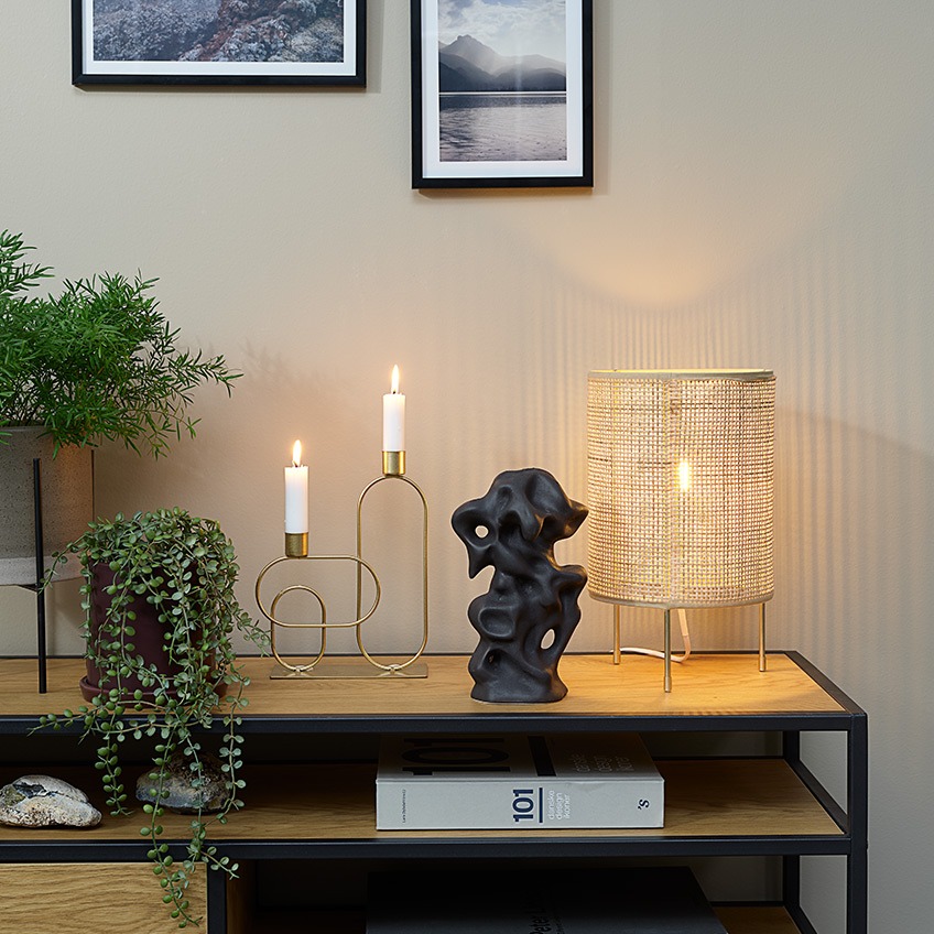 SVENN artificial plant in AXEL plant pot, ERVIN candlestick, STEN ornament and ALBERT table lamp Plant pots, artificial plants, candlestick, ornament and table lamp on top of a TV stand