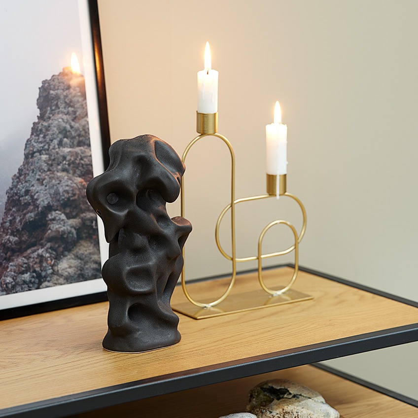 STEN ornament and ERVIN candlestick Candlestick in gold-look and black, crooked sculpture