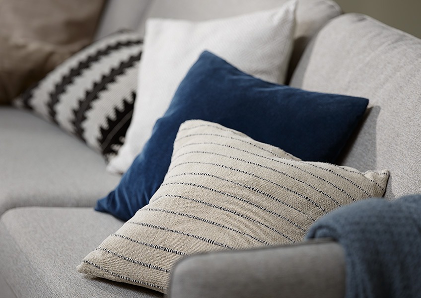 Cushions POPPEL in beige, SKOGSIV in black/white, ENGKARSE in striped beige and DUSKULL cushion cover in dark blue Multiple sofa cushions and cushion covers in different colours and materials