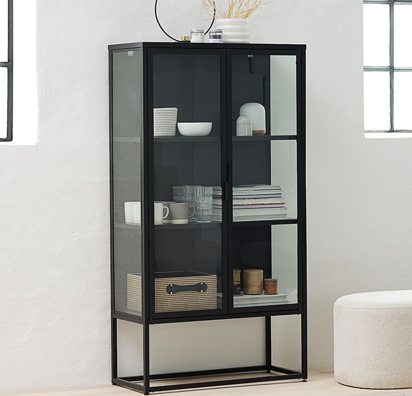 VIRUM cabinet with glass doors and sides Black cabinet with glass doors and sides in a light room