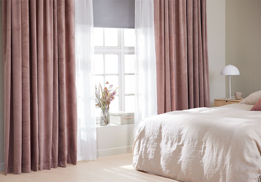 BOLGA black out curtain in light grey, BOLMEN light curtain in white and AUSTRA heavy curtain in velvet rose Bedroom with light curtains halfway open and the light shining in