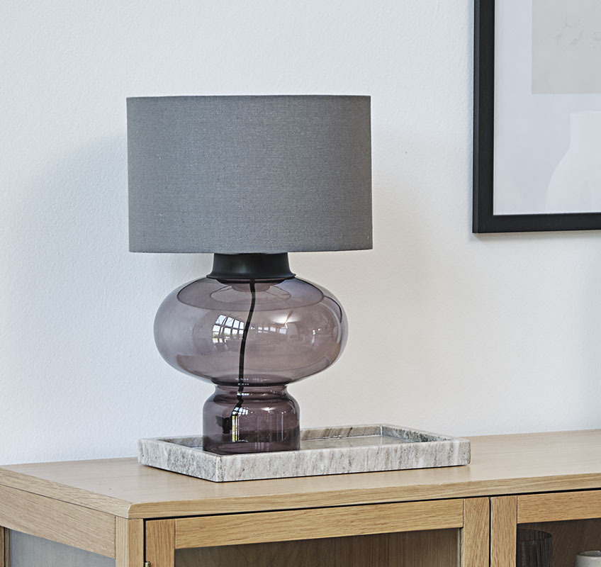 EDMUND table lamp Table lamp with glass base and grey lampshade on a marble tray
