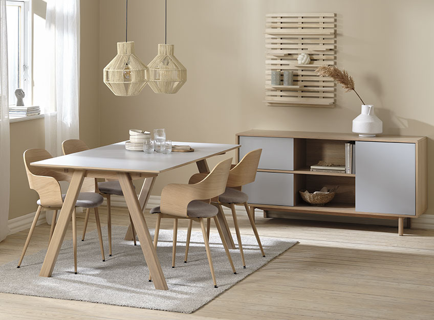Dining room with dining table and chairs on rug 