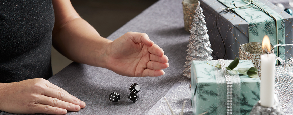 Person rolling dice